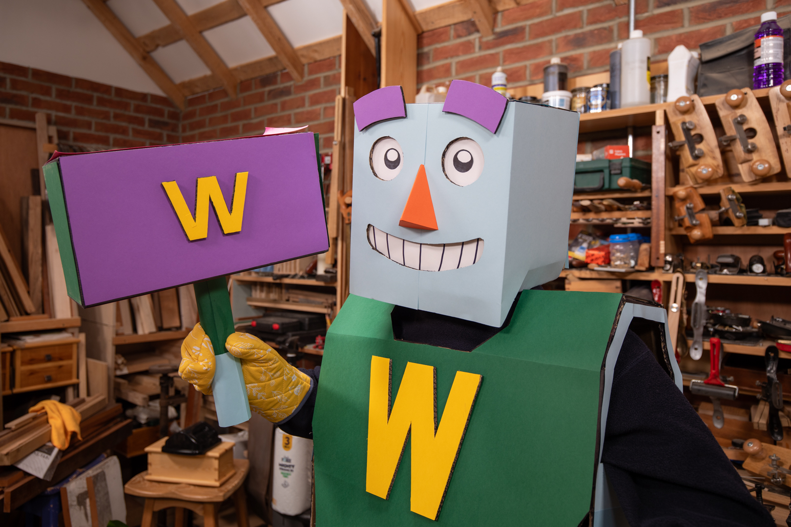 Woody with arm raised, identifying optimal chisel angle